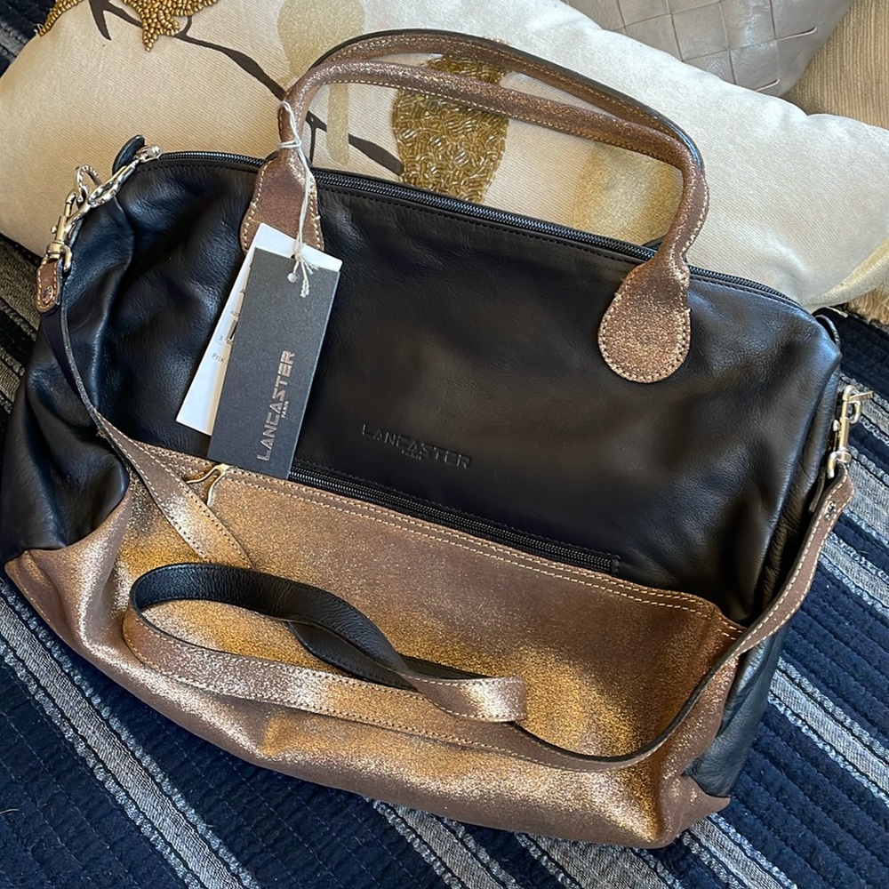 New with tags Lancaster black and gold handbag.